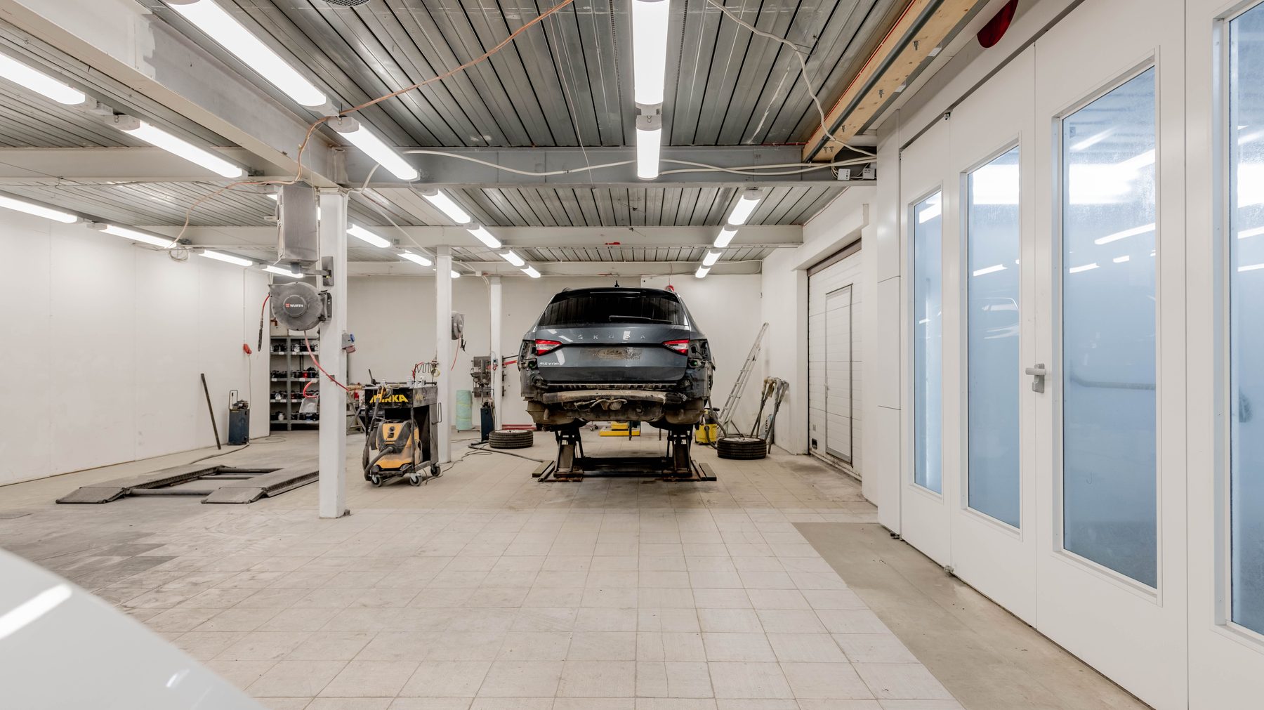 A clean body shop with spray booth doors